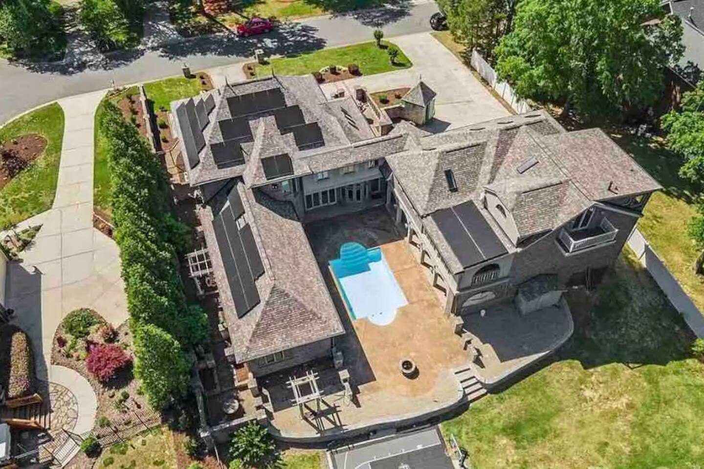 Aerial view of a large home with a pool